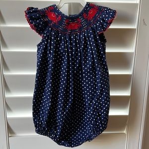Navy blue and white polka dot smocked crab bubble suit